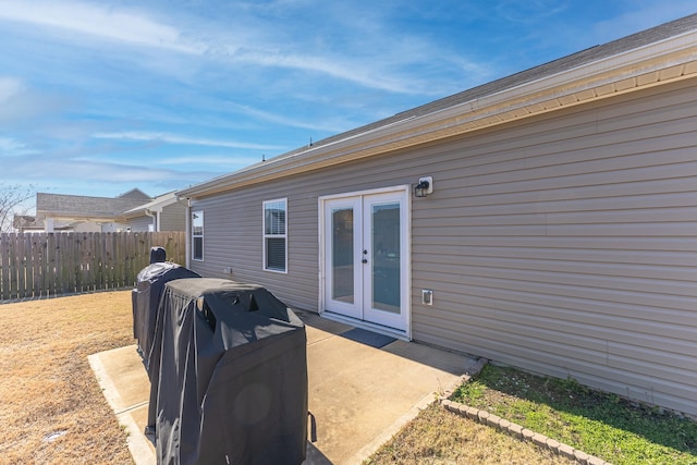 rear view of property with french doors and a patio