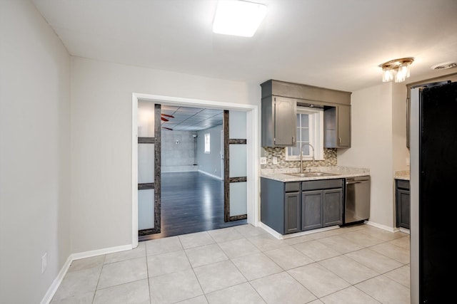 2705 S Vernon Dr, Augusta, GA 30906 - kitchen featuring stainless steel appliances, gray cabinetry, tasteful backsplash, light tile patterned flooring, and light stone counters