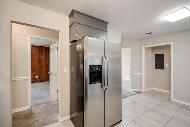 2705 S Vernon Dr, Augusta, GA 30906 - kitchen featuring stainless steel fridge with ice dispenser, light colored carpet, electric panel, and light tile patterned floors
