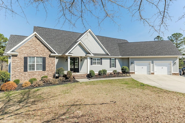 view of front of property with a garage and a front yard