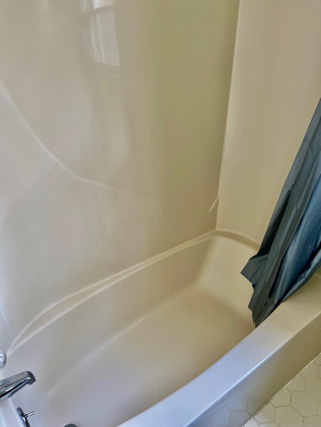 bathroom with tile patterned floors