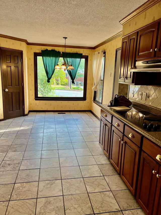 dining room featuring crown molding, a textured ceiling, and baseboards