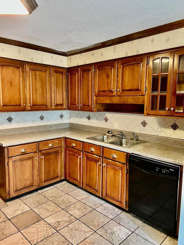kitchen with dishwasher, a sink, a textured ceiling, light marble finish floors, and brown cabinets