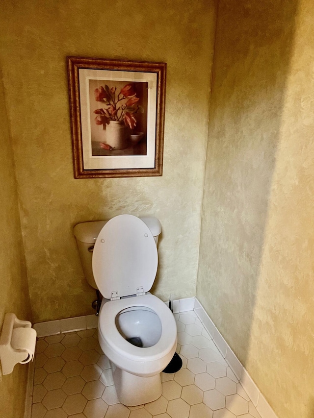 bathroom featuring tile patterned flooring and toilet