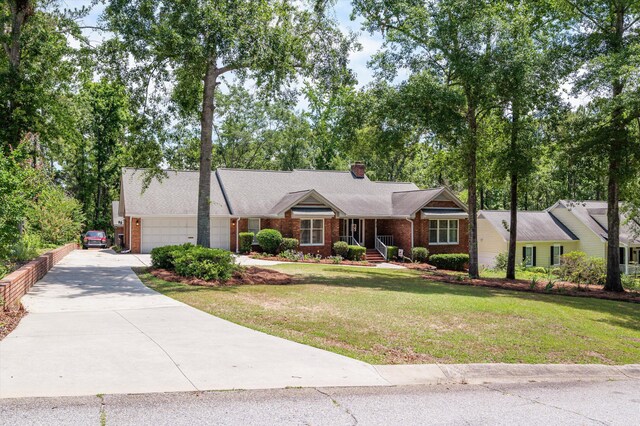 914 Deercrest Cir, Evans, GA 30809 - ranch-style house with a garage, concrete driveway, a front lawn, brick siding, and a chimney