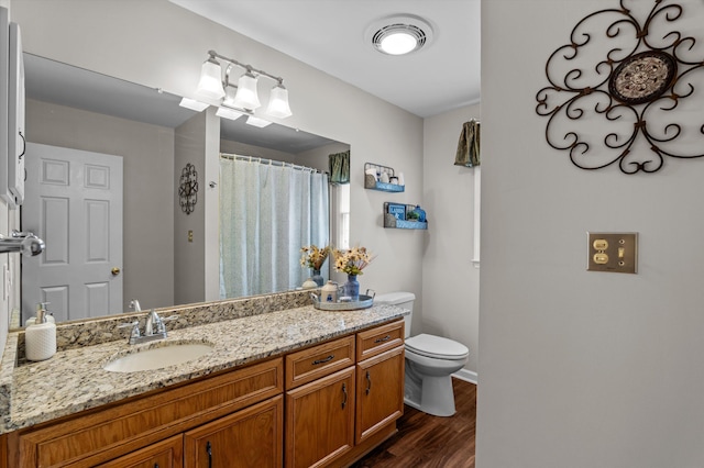 914 Deercrest Cir, Evans, GA 30809 - full bathroom featuring toilet, vanity, wood finished floors, baseboards, and a shower with curtain