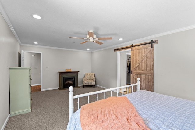 914 Deercrest Cir, Evans, GA 30809 - carpeted bedroom with recessed lighting, ornamental molding, a fireplace, baseboards, and a barn door
