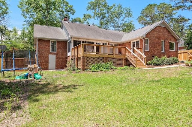 914 Deercrest Cir, Evans, GA 30809 - back of property with a trampoline, brick siding, a chimney, a wooden deck, and stairs