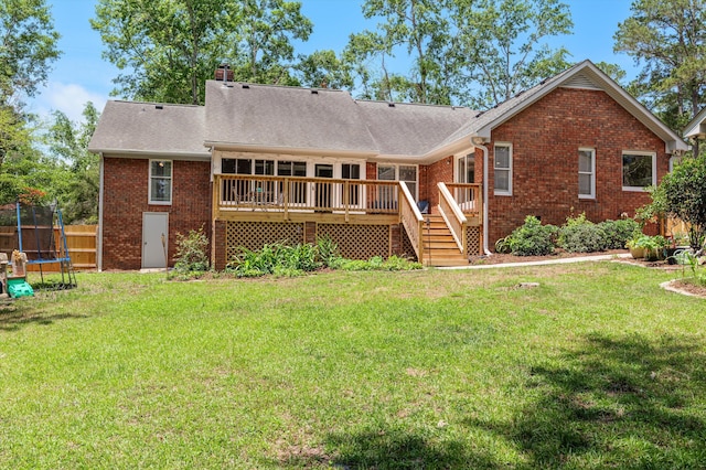 914 Deercrest Cir, Evans, GA 30809 - back of house with a trampoline, brick siding, a wooden deck, and stairs