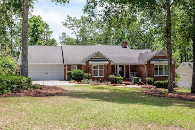 914 Deercrest Cir, Evans, GA 30809 - single story home with brick siding, a garage, a chimney, driveway, and a front lawn