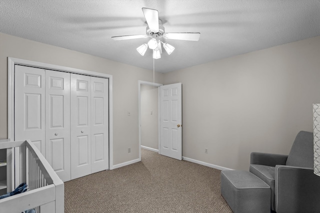 914 Deercrest Cir, Evans, GA 30809 - carpeted bedroom featuring a closet, baseboards, ceiling fan, and a textured ceiling