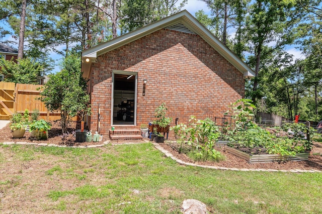 914 Deercrest Cir, Evans, GA 30809 - view of property exterior featuring brick siding, a vegetable garden, and entry steps