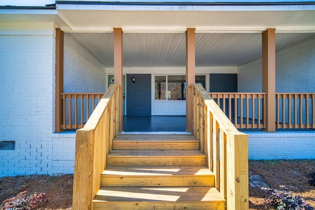 doorway to property featuring a porch