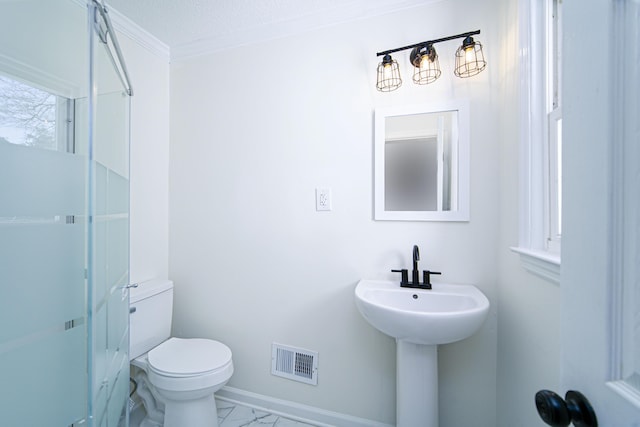 bathroom with toilet, sink, and a textured ceiling