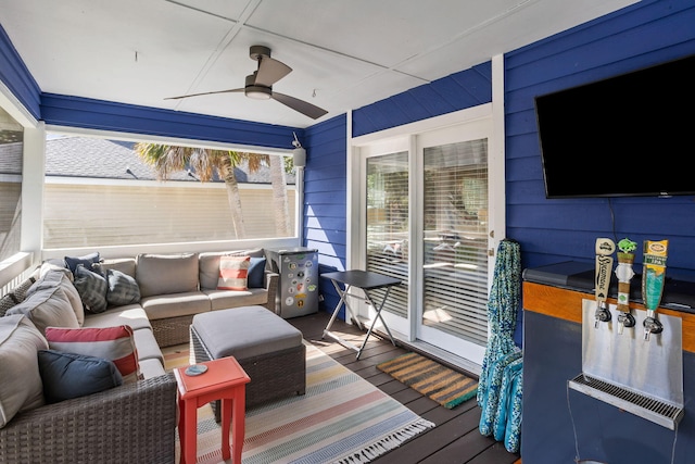 deck with an outdoor hangout area and ceiling fan