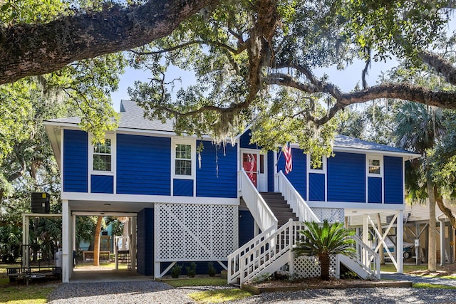 view of front of property featuring a carport