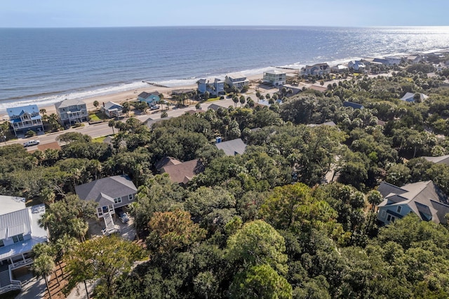 birds eye view of property featuring a water view and a view of the beach