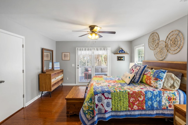 bedroom featuring access to exterior, ceiling fan, and dark hardwood / wood-style flooring