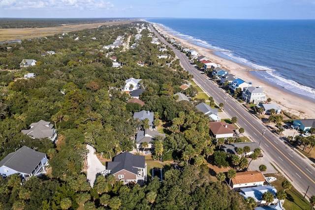 birds eye view of property with a view of the beach and a water view