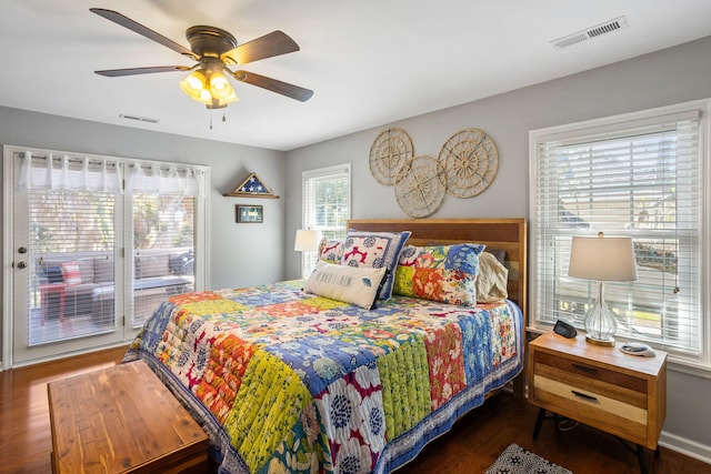 bedroom with ceiling fan and dark hardwood / wood-style floors