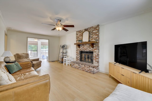 3866 Villa Ln, Martinez, GA 30907 - living area featuring crown molding, a ceiling fan, a fireplace, and light wood-style floors