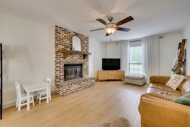 3866 Villa Ln, Martinez, GA 30907 - living area with wood finished floors, a fireplace, ornamental molding, and a ceiling fan