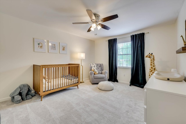 3866 Villa Ln, Martinez, GA 30907 - bedroom with a crib, light colored carpet, and ceiling fan