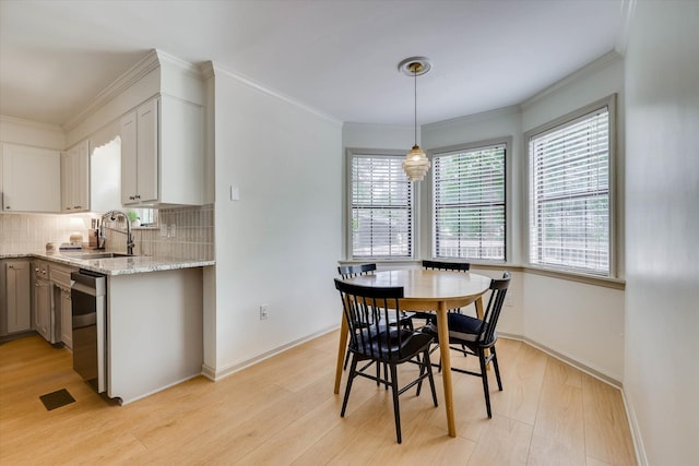 3866 Villa Ln, Martinez, GA 30907 - dining room featuring light wood finished floors and crown molding