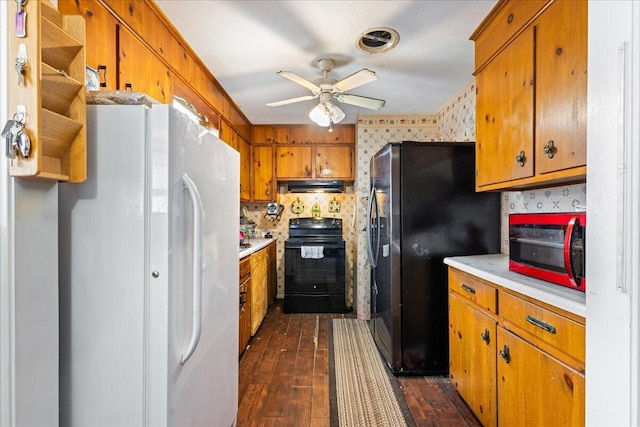 kitchen featuring stainless steel refrigerator, dark hardwood / wood-style flooring, white fridge, ceiling fan, and black range with electric stovetop