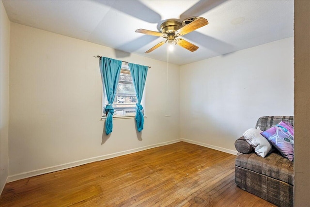 unfurnished room featuring ceiling fan and wood-type flooring