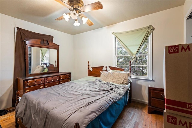 bedroom featuring hardwood / wood-style flooring and ceiling fan