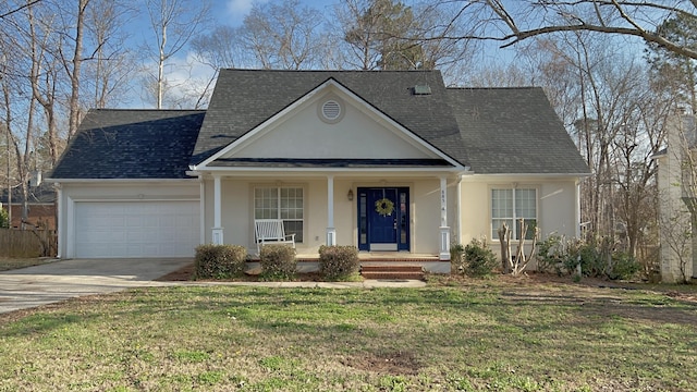 view of front of home with a porch, a garage, and a front yard