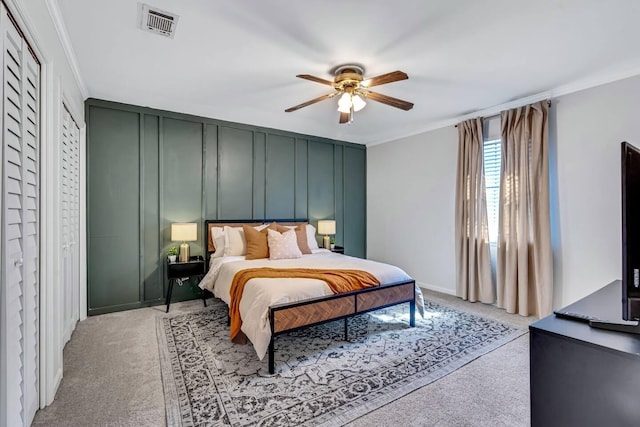 2928 Foxhall Cir, Augusta, GA 30907 - carpeted bedroom with a decorative wall, ornamental molding, a ceiling fan, and baseboards