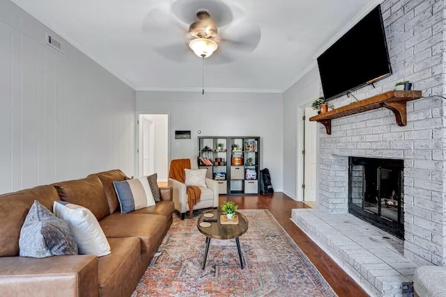 2928 Foxhall Cir, Augusta, GA 30907 - living area featuring a ceiling fan, dark wood-style floors, a fireplace, and crown molding