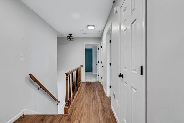 2928 Foxhall Cir, Augusta, GA 30907 - hall with an upstairs landing, attic access, wood finished floors, and baseboards
