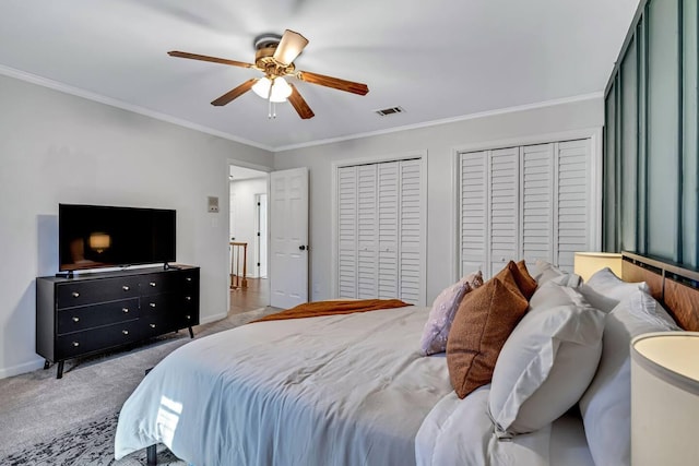 2928 Foxhall Cir, Augusta, GA 30907 - bedroom with crown molding, carpet floors, ceiling fan, multiple closets, and baseboards