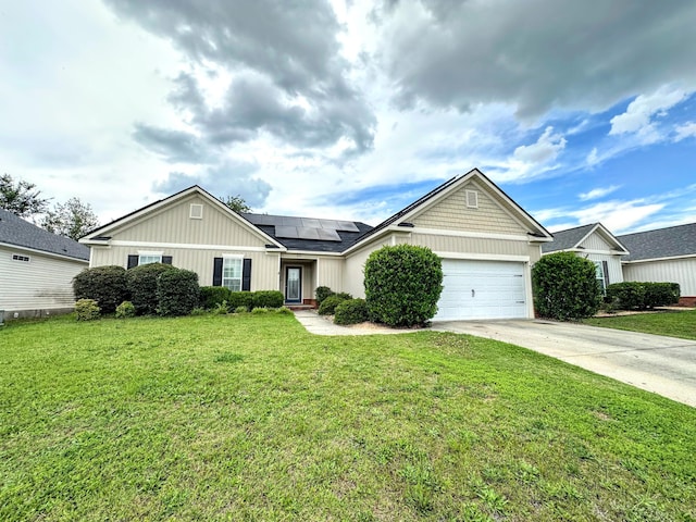 903 Arbor Springs Cir, Grovetown, GA 30813 - view of front of property featuring solar panels, driveway, an attached garage, and a front yard