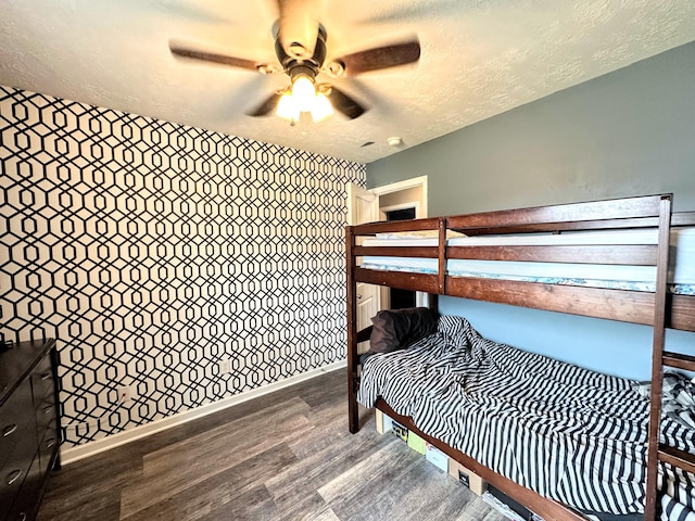 903 Arbor Springs Cir, Grovetown, GA 30813 - bedroom featuring dark wood-style flooring, a textured ceiling, and a ceiling fan
