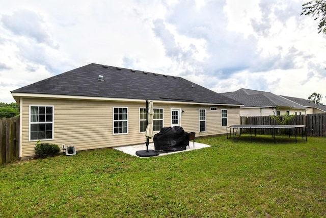 903 Arbor Springs Cir, Grovetown, GA 30813 - rear view of house with a trampoline, a fenced backyard, and a patio area
