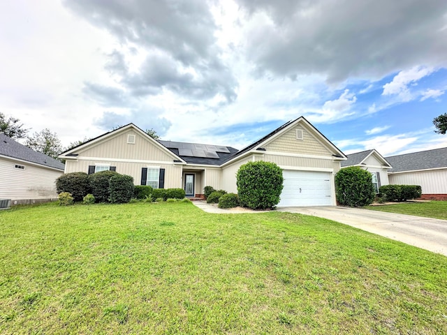 903 Arbor Springs Cir, Grovetown, GA 30813 - ranch-style house featuring roof mounted solar panels, concrete driveway, a front lawn, and a garage