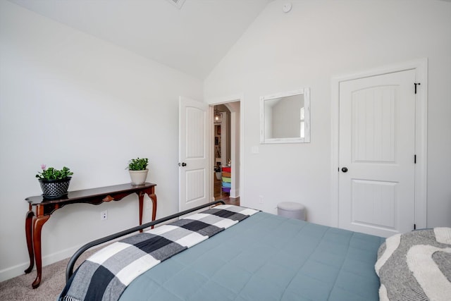 carpeted bedroom featuring vaulted ceiling