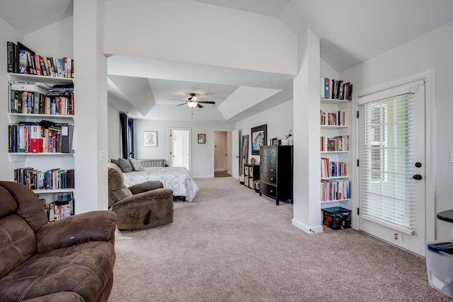 living area featuring lofted ceiling, carpet, a ceiling fan, and baseboards