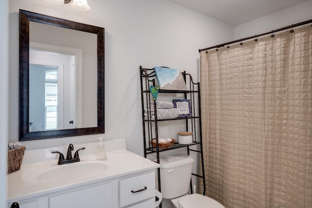 bathroom with vanity, toilet, and a shower with curtain