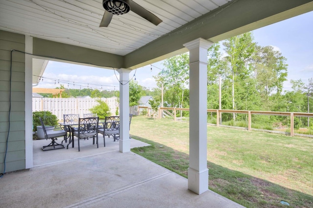 view of patio featuring ceiling fan, a fenced backyard, and outdoor dining area