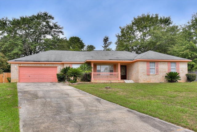 ranch-style home with a garage and a front lawn