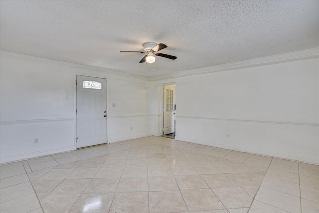 unfurnished room featuring a textured ceiling, light tile patterned floors, and crown molding