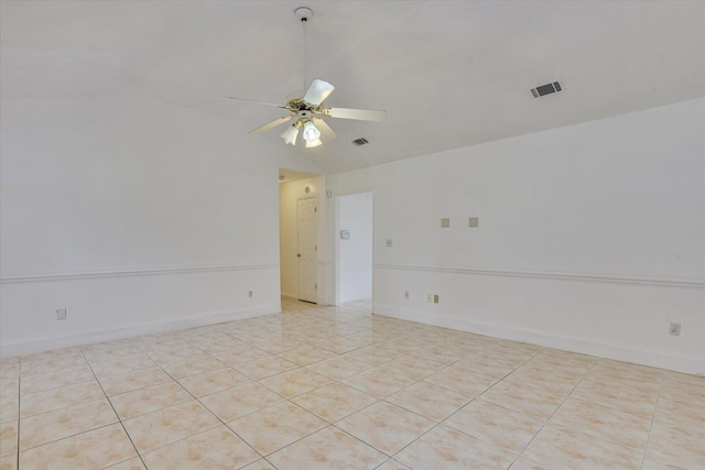 spare room featuring light tile patterned floors, ceiling fan, and lofted ceiling