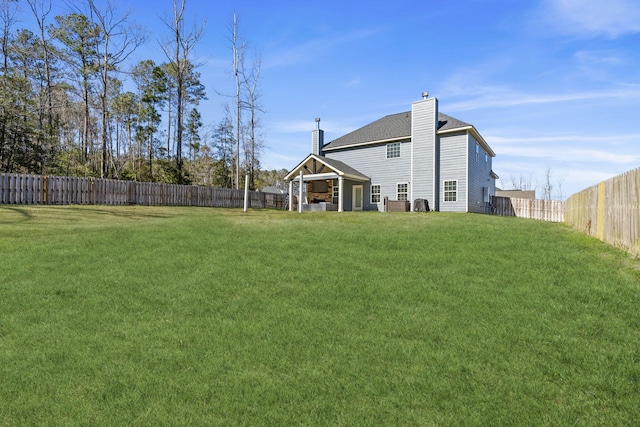 view of yard featuring a fenced backyard