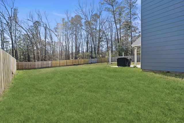 view of yard with a fenced backyard