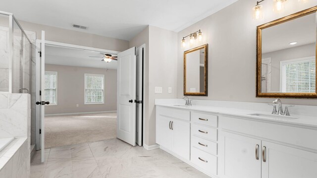 full bath with a wealth of natural light, visible vents, an enclosed shower, and a sink